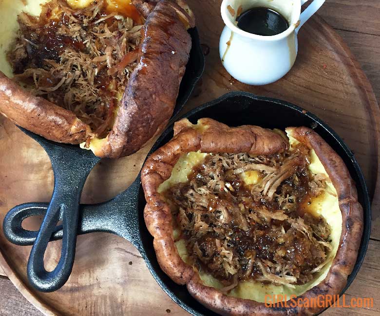 2 Dutch baby skillets topped with pulled pork