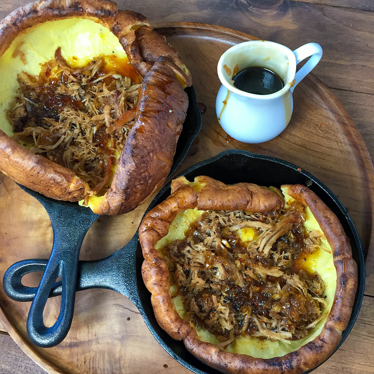 Dutch baby pancakes topped with pulled pork.