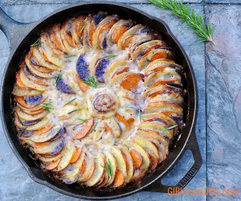 tri-color sweet potatoes spiraled in cast iron with baked cream sauce
