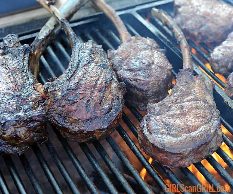 6 tomahawk steaks on a grill