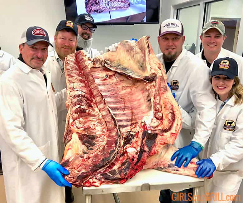 group posing with beef prior to breaking it down.
