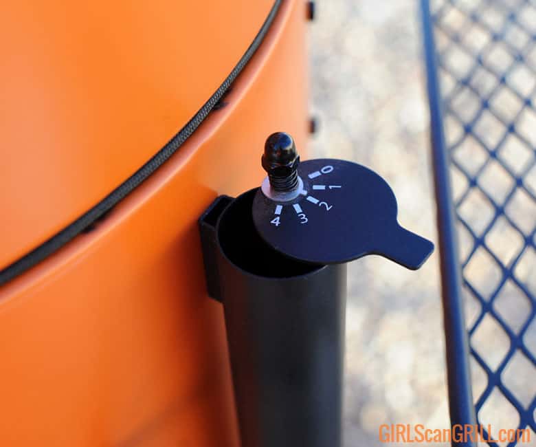 intake valve on orange Oklahoma Joe's Bronco Pro Drum Smoker.