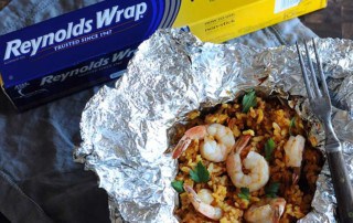 foil packet with cooked seafood paella