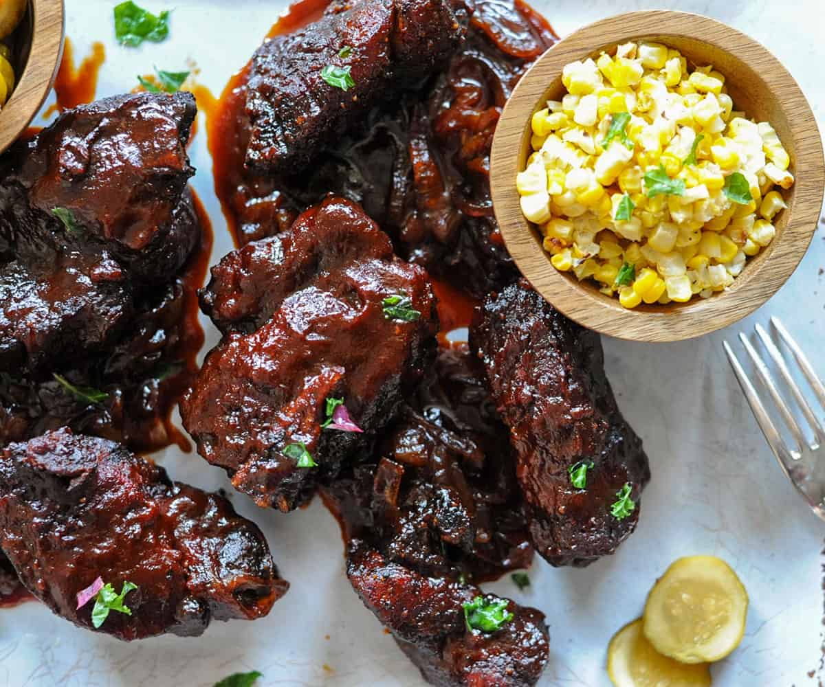 country style pork ribs platter with bowl of corn