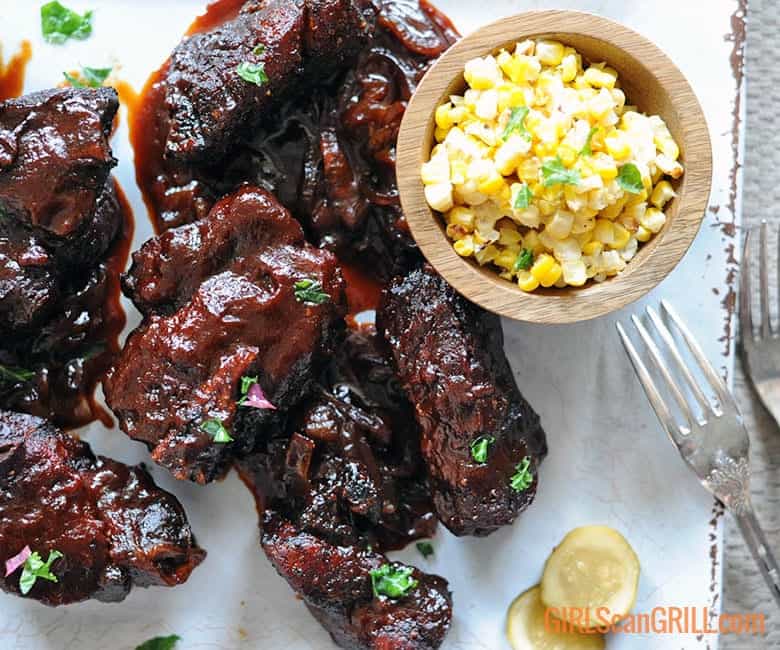 country style pork ribs platter with bowl of corn