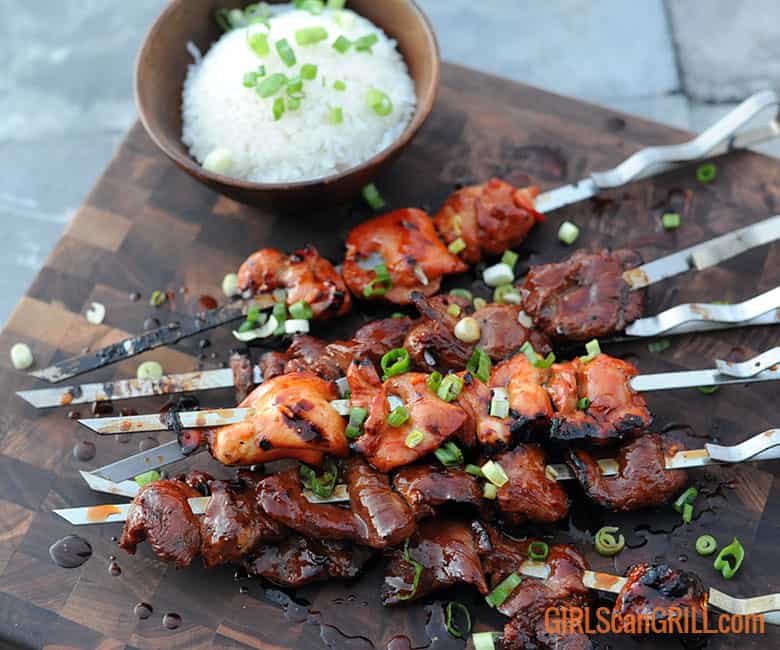 skewers of pork and chicken Filipino BBQ with a bowl of white rice