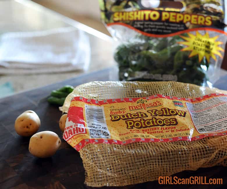bag of yellow potatoes and bag of shishito peppers.