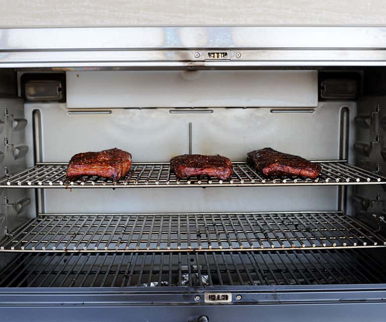 ribs smoking in Clermont pellet grill.