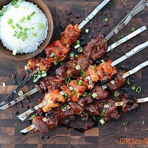 skewers of pork and chicken Filipino BBQ with a bowl of white rice