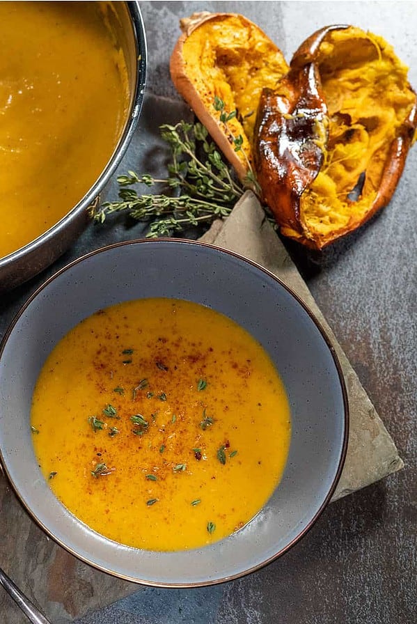 bowl and skillet of Grilled Butternut Squash Soup
