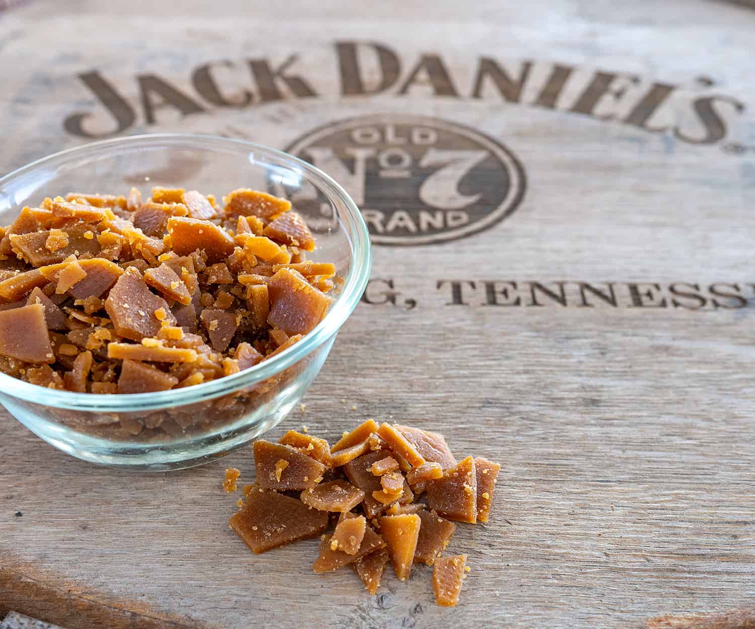 bowl of whiskey toffee on Jack Daniel's barrel head