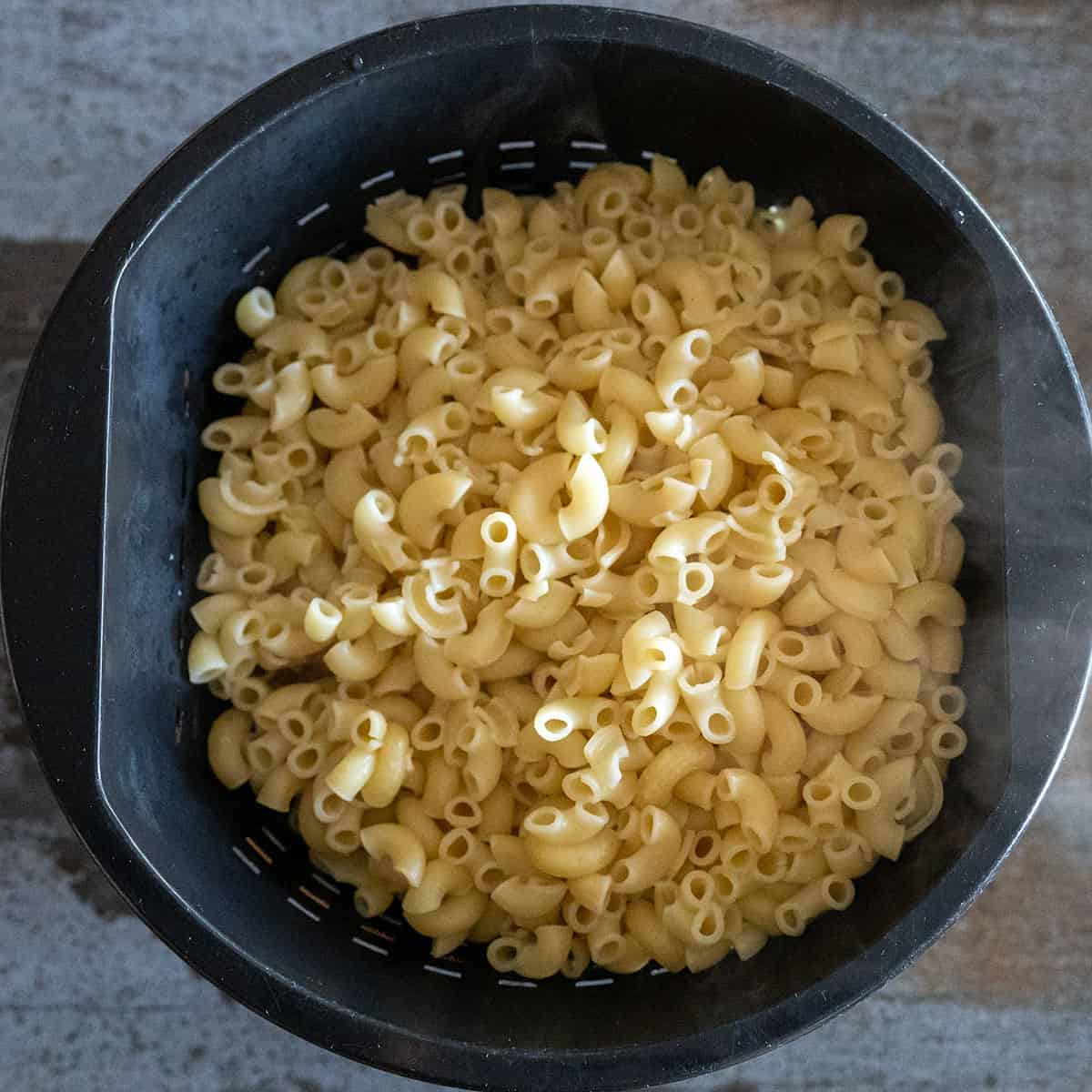 macaroni noodles draining in a colander.