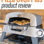 Cuisinart 3-in-1 Pizza Oven Plus with pizza coming out front door on peel