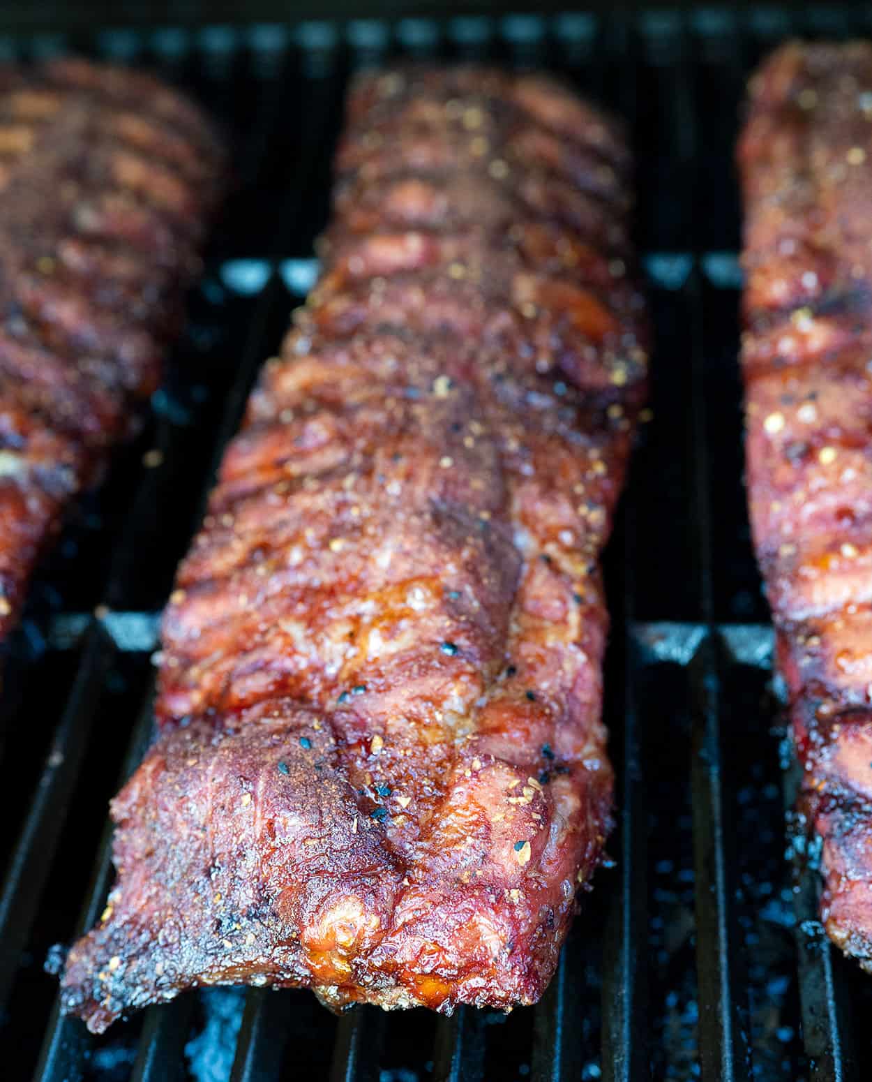pork ribs on grill after smoking for 3 hours