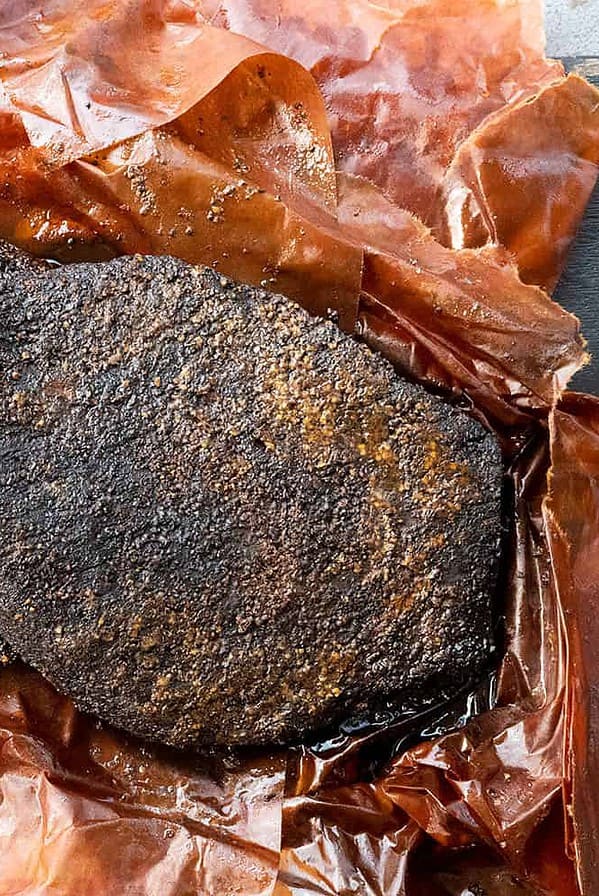 smoked brisket unwrapped in butcher paper