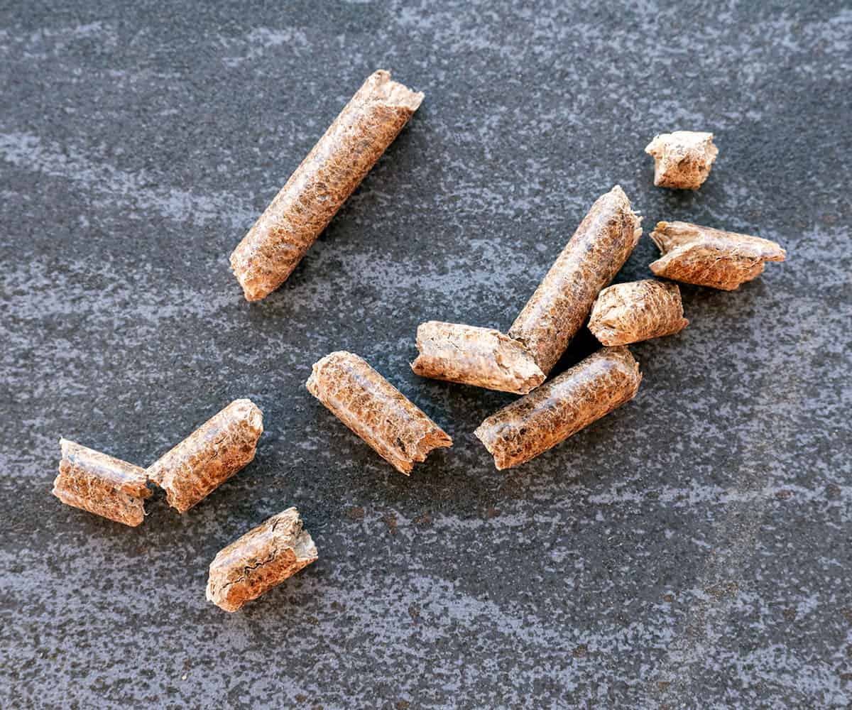 A small pile of wood pellets on a counter.