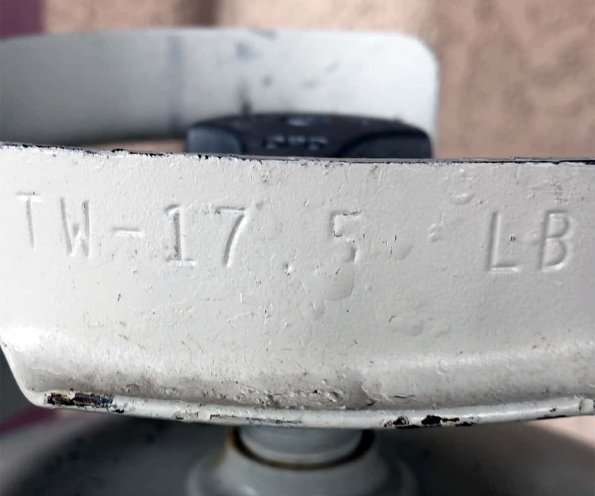 propane tank handle showing tare weight equals 17.5 pounds.
