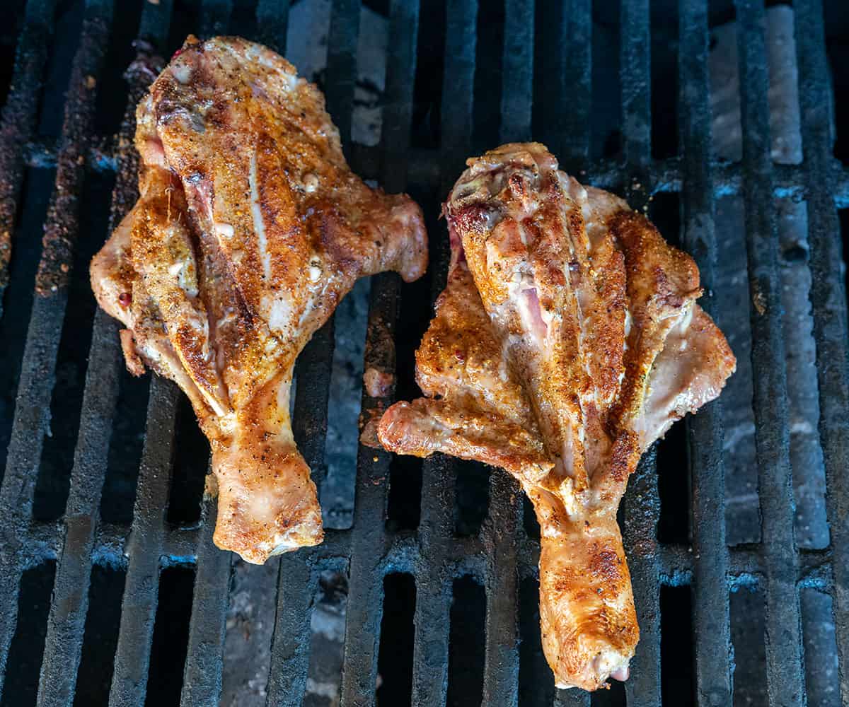 butterflied turkey legs on grill.
