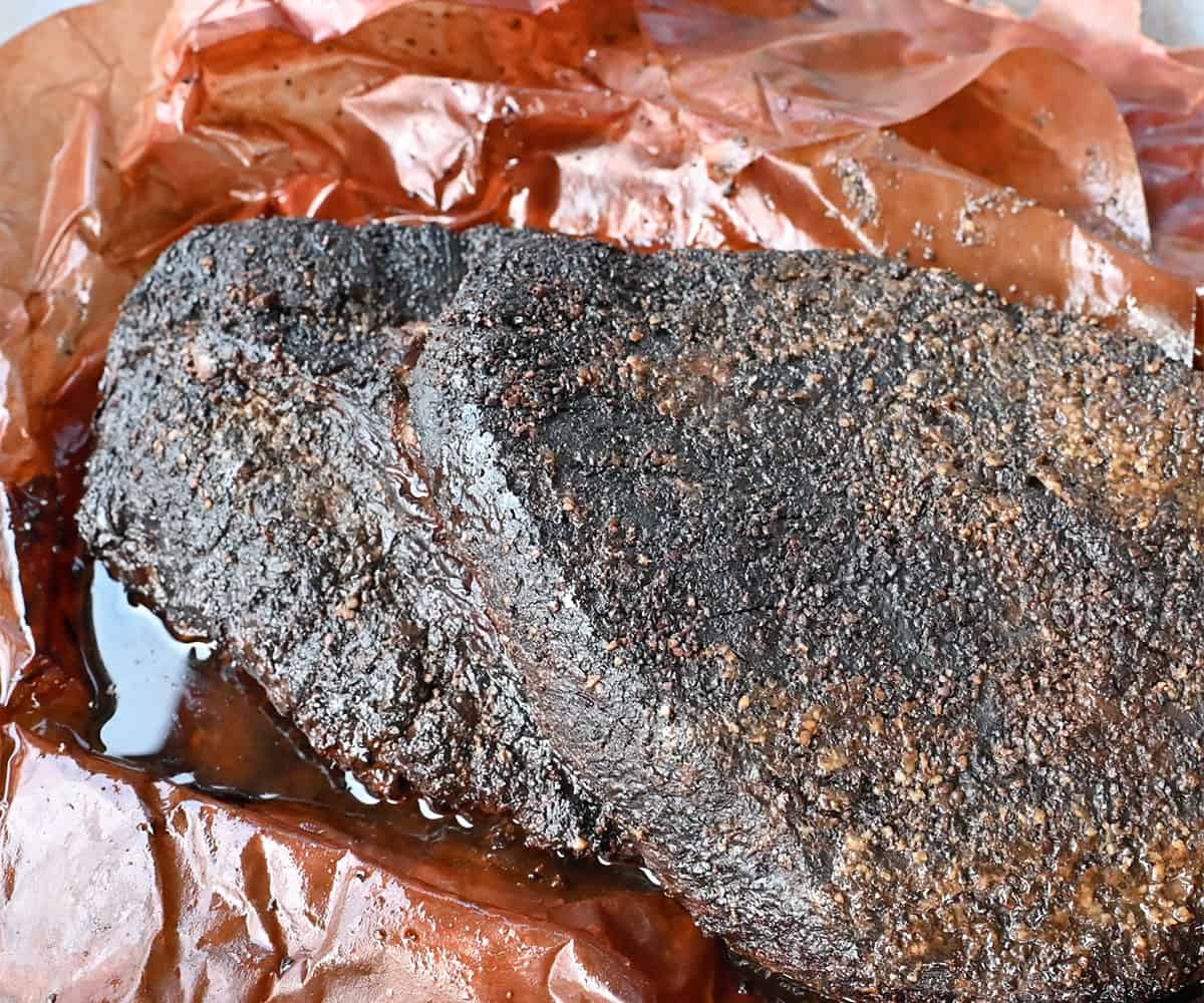 Smoked brisket unwrapped from peach butcher paper.