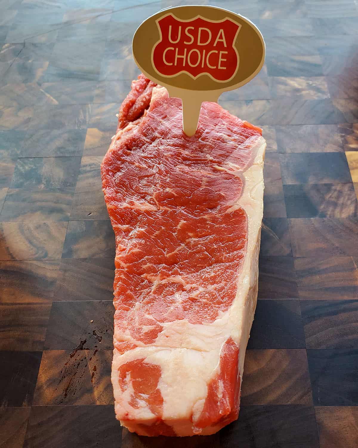 USDA graded choice steak with minimal marbling.