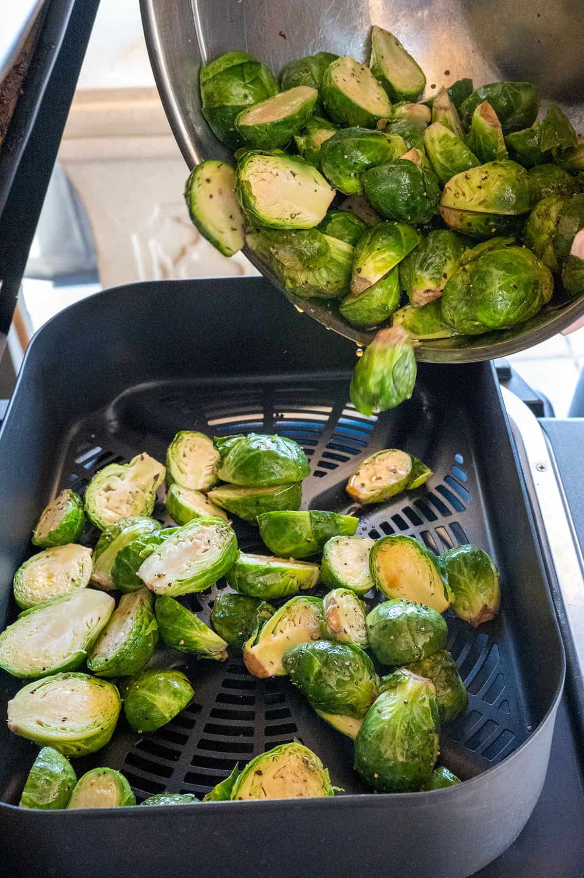 Adding brussels sprouts to Ninja Grill.