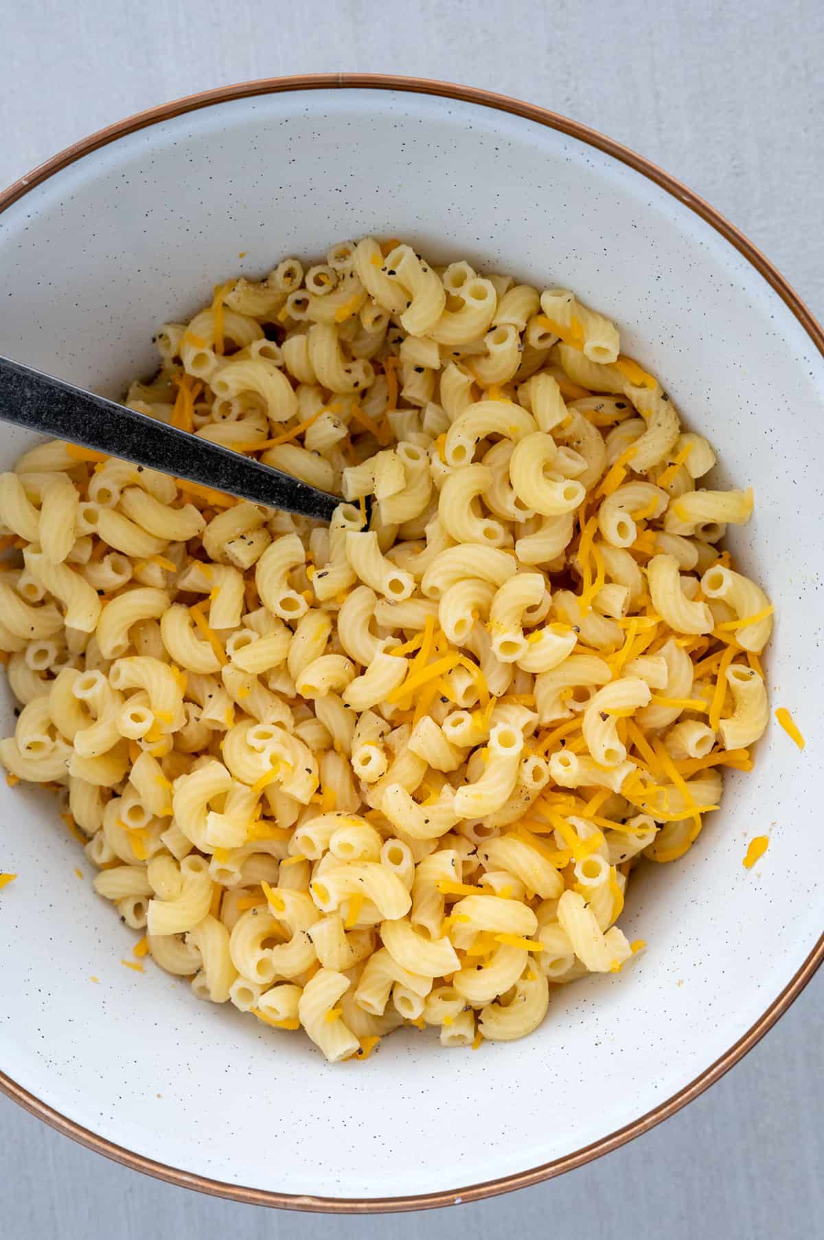 mixing seasoning, noodles and cheddar cheese.