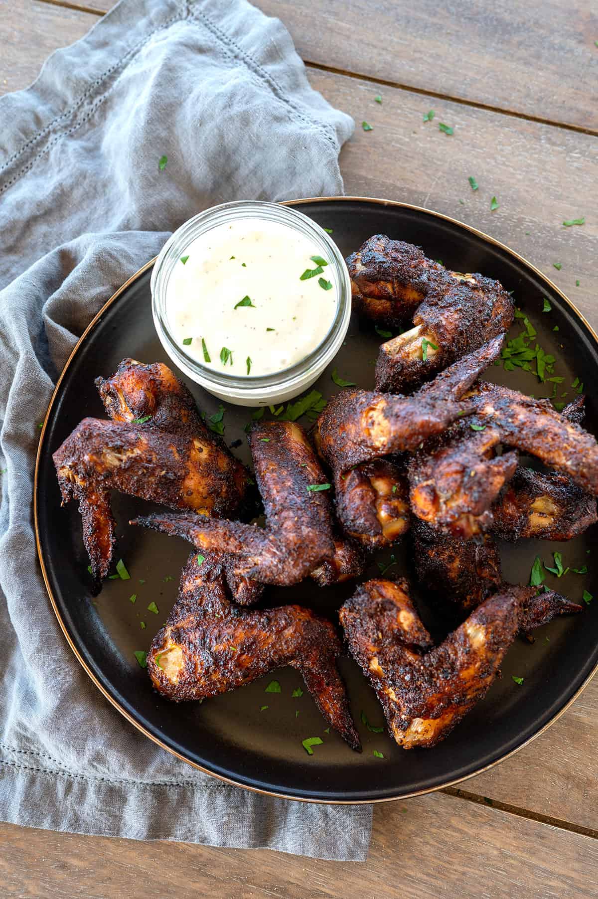chicken wings on plate with ranch.