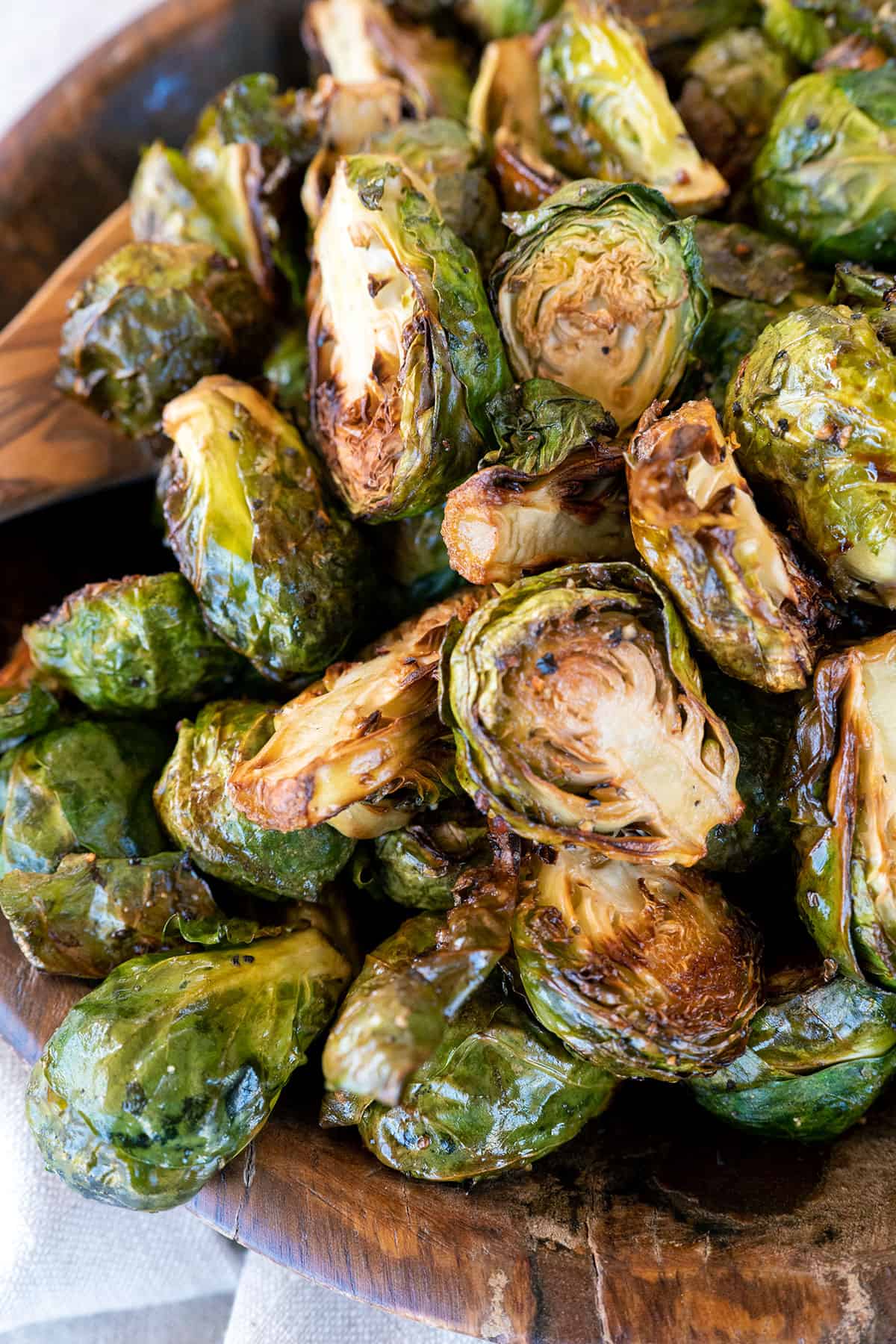close up of bowl of grilled brussels sprouts.