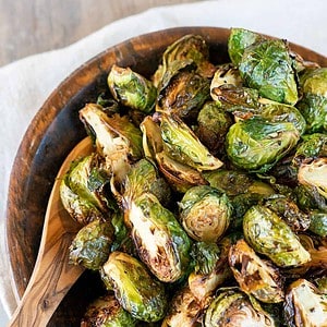bowl full of grilled brussels sprouts.