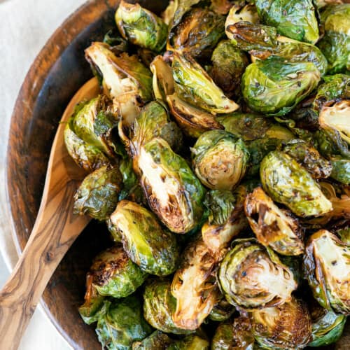 bowl full of grilled brussels sprouts.