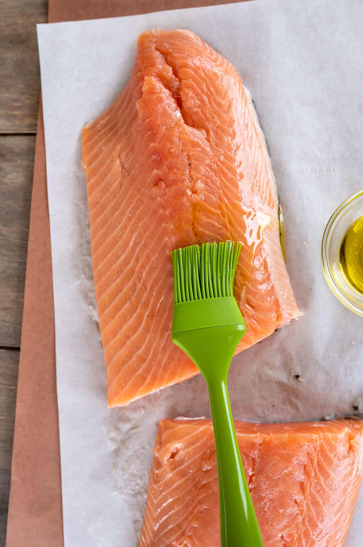 basting salmon with oil.