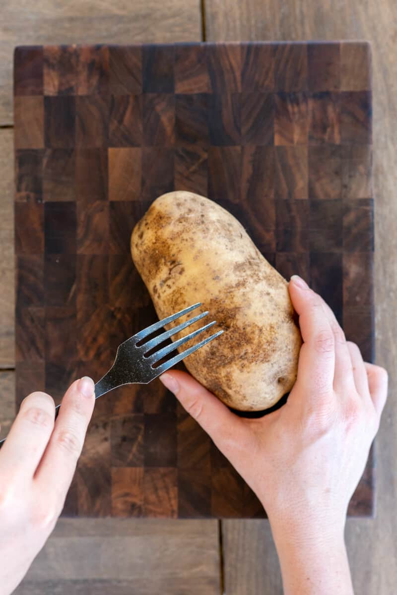 fork piercing potato.