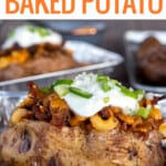 Loaded baked potato on table in pan.