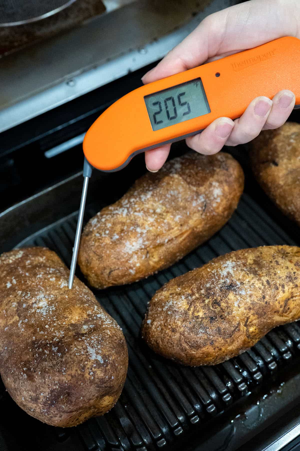 instant read thermometer showing potatoes at 205F degrees.