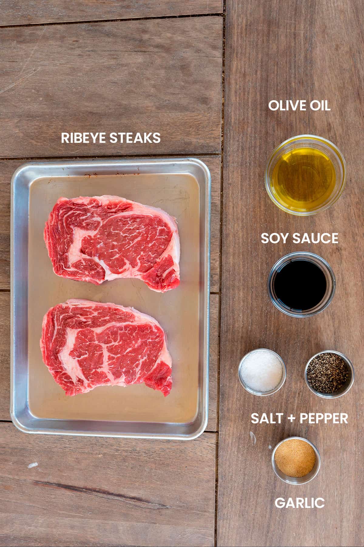 grilled ribeye steak ingredients: ribeye steaks, olive oil, soy sauce, salt, pepper and garlic.