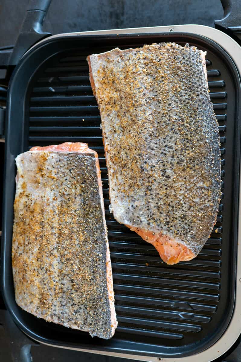 salmon on grill skin side up.