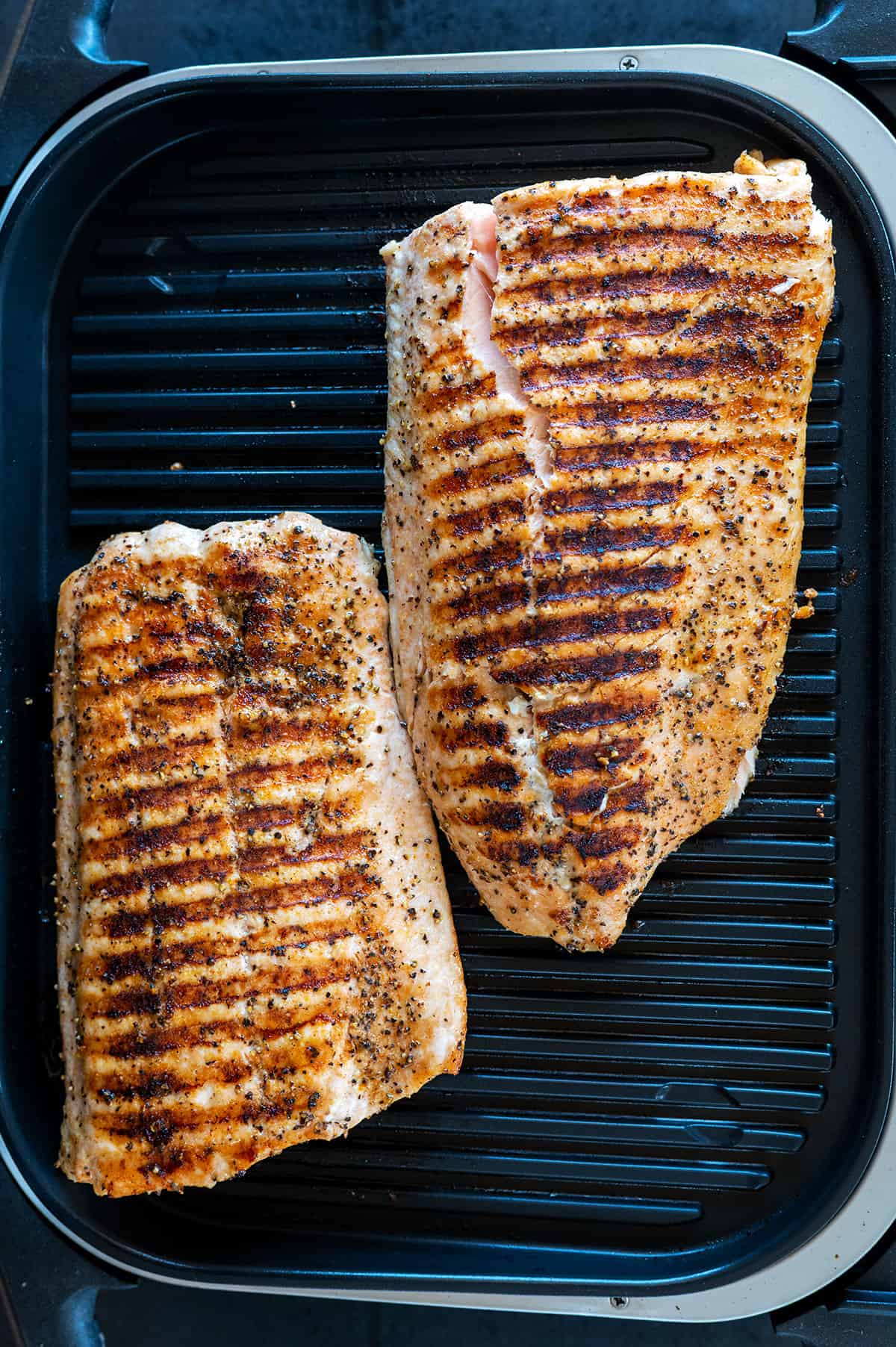 salmon on grill skin side down.