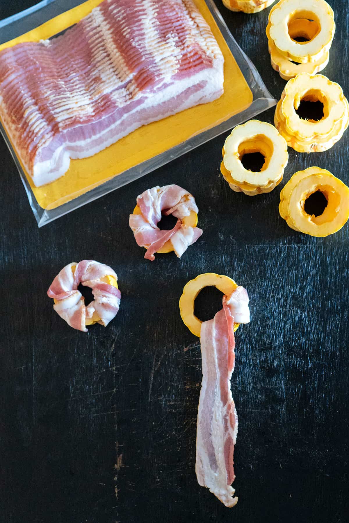 bacon strip pulled through center of delicata squash ring.
