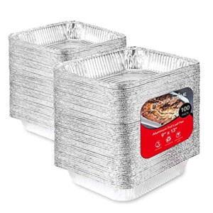 two stacks of aluminum half pans.