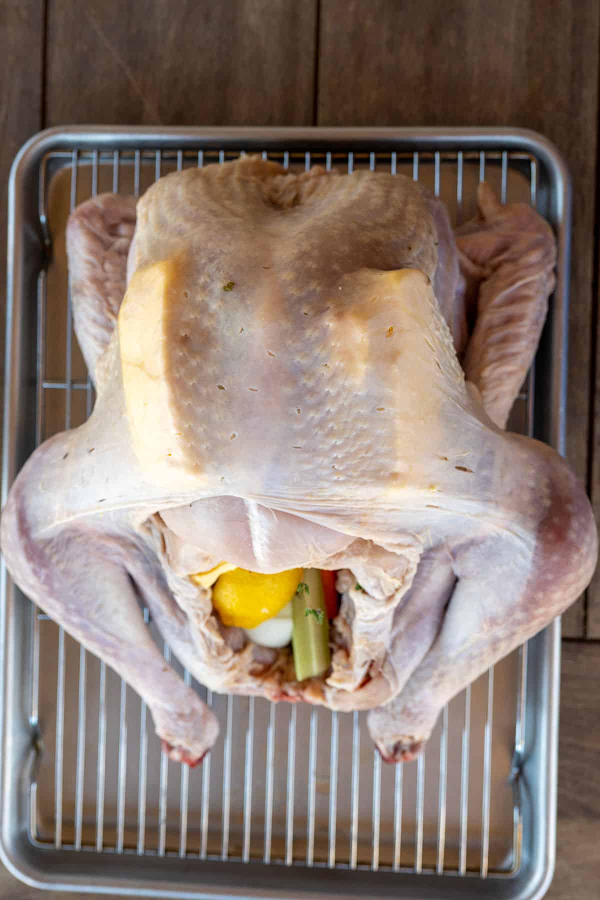turkey cavity stuffed with vegetables, herbs and butter.