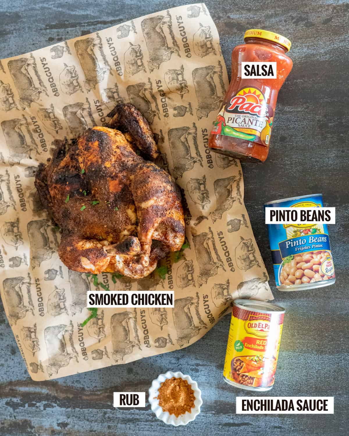 chicken chili ingredients: roasted chicken, salsa, pinto beans, enchilada sauce, rub.