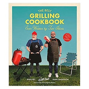 cookbook with two dads by a grill on cover.