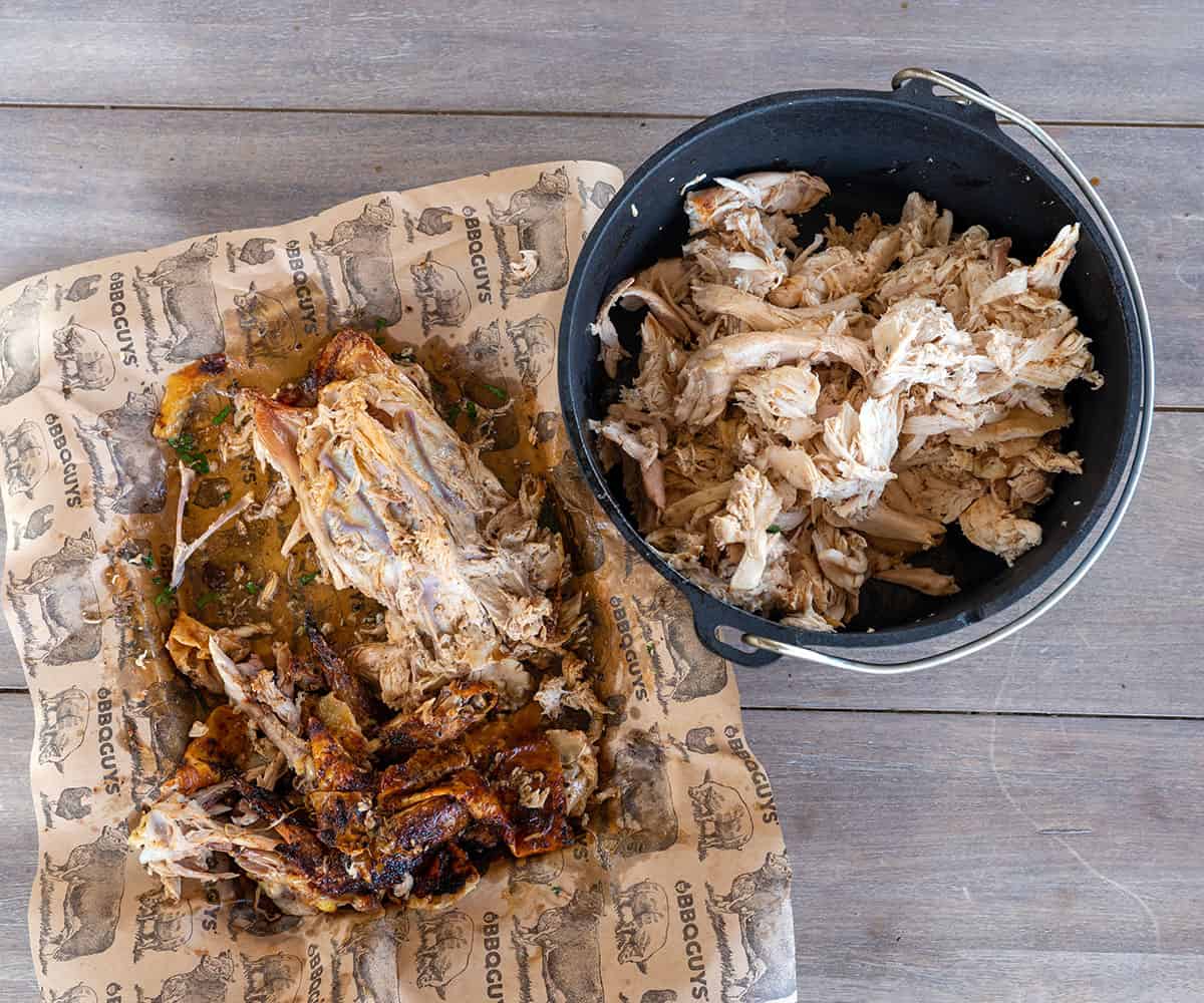 meat pulled from chicken next to bones.