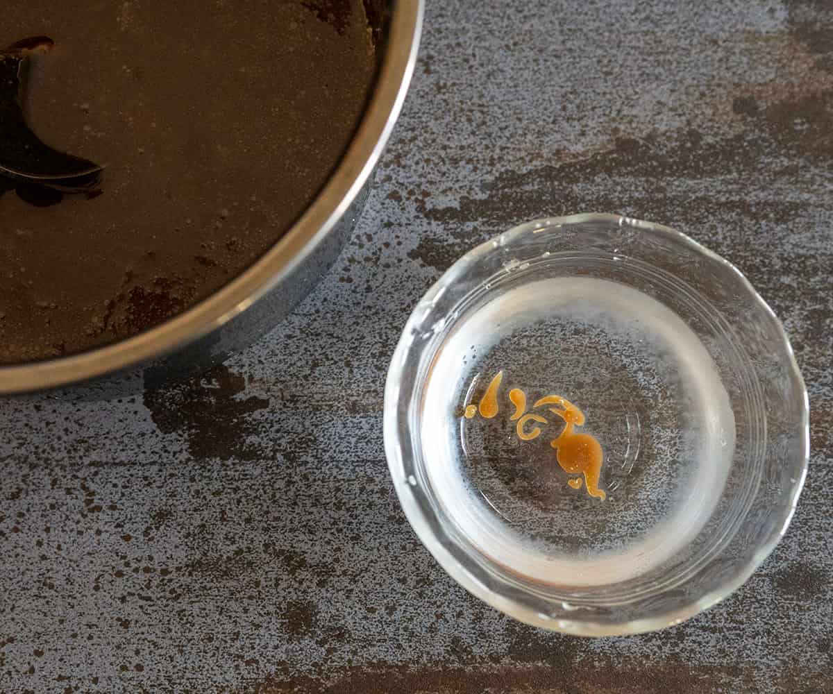 syrup in bowl of cold water that formed into a soft ball.