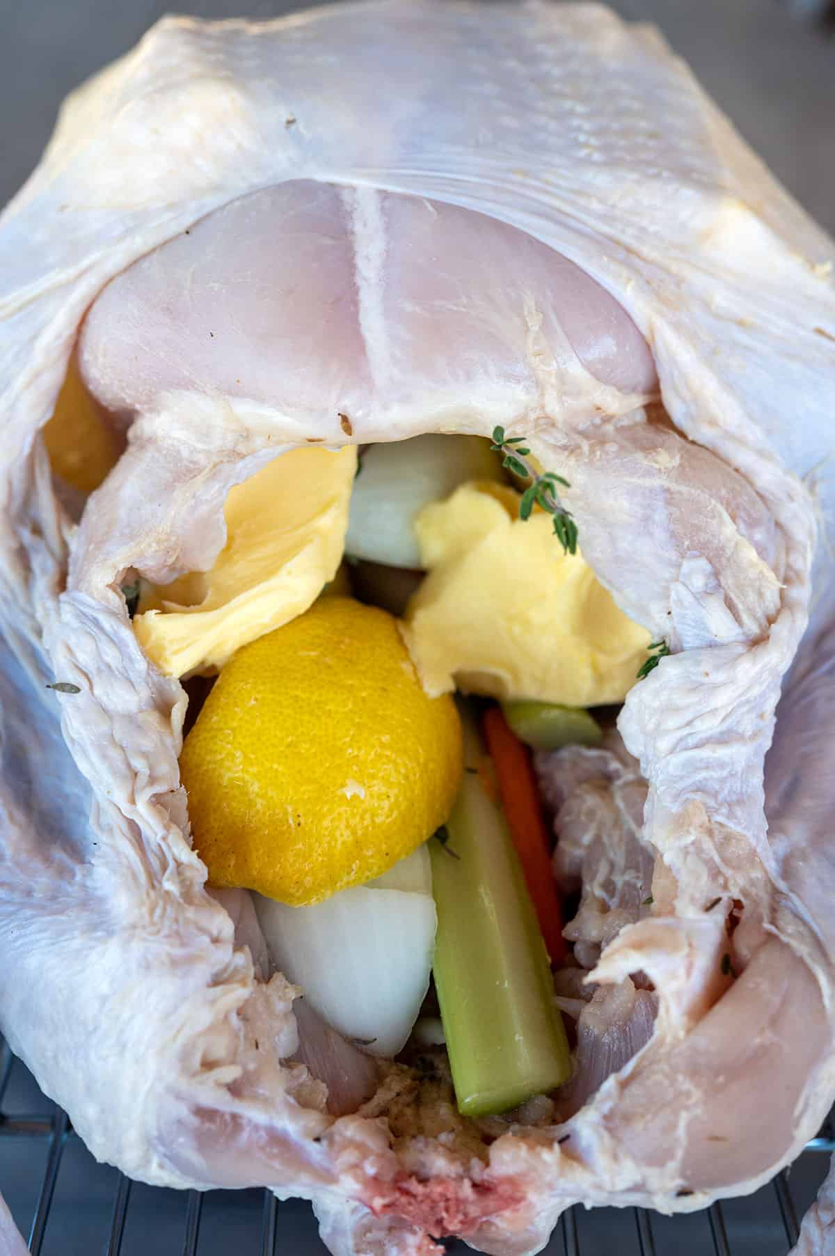 turkey cavity stuffed with vegetables, herbs and butter.