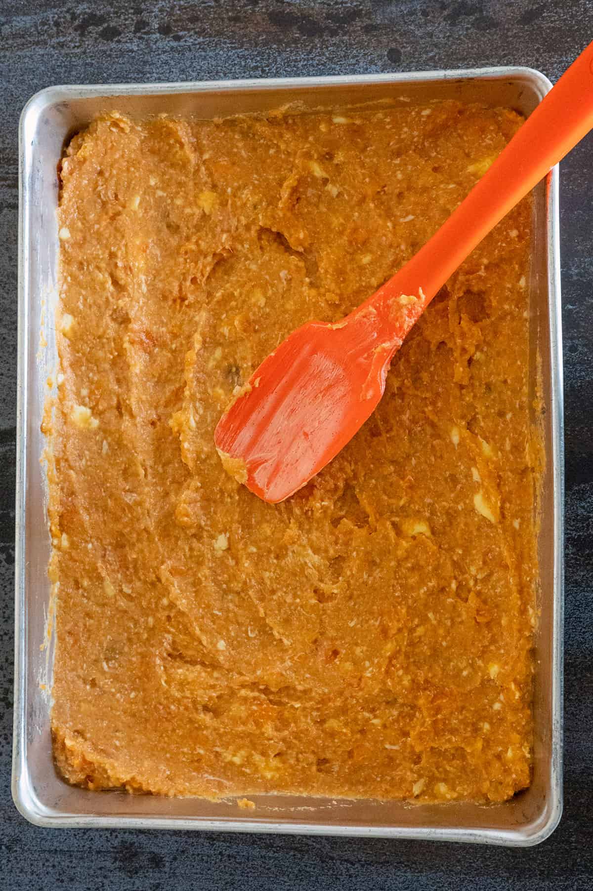 mashed sweet potatoes spread in pan.