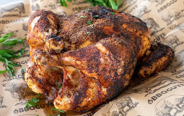 grilled whole chicken on butcher paper.