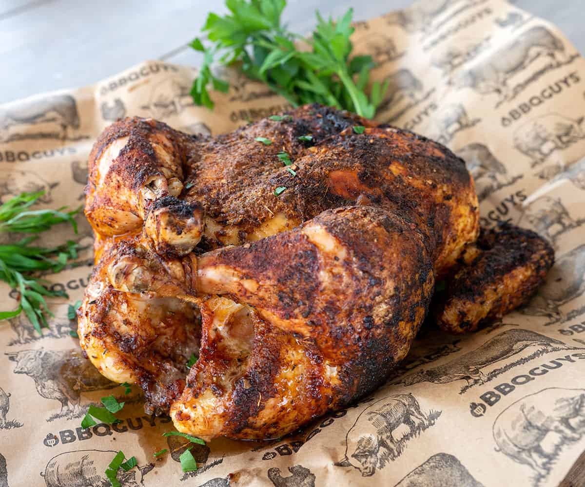 grilled whole chicken on butcher paper.
