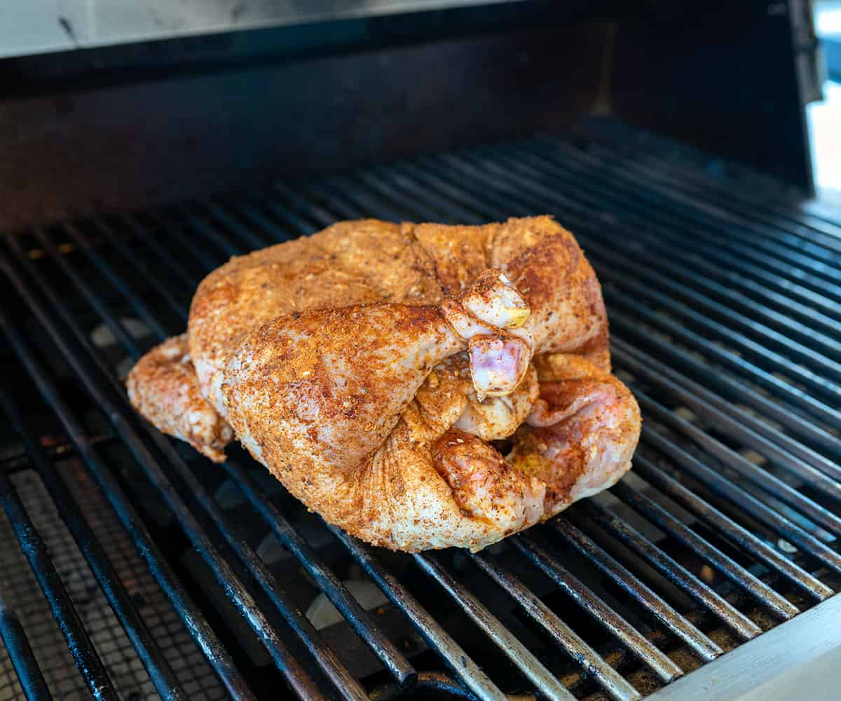 whole chicken on the grill over indirect heat.