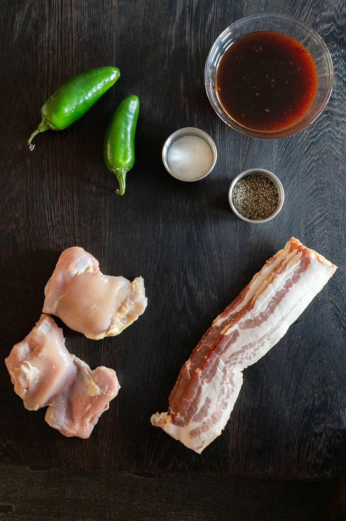 jalapeno, salt, pepper, raspberry chipotle sauce, boneless chicken thigh, bacon strips.